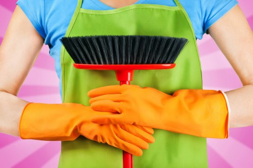 Carpet cleaning technician working safely with equipment in a protected indoor setting