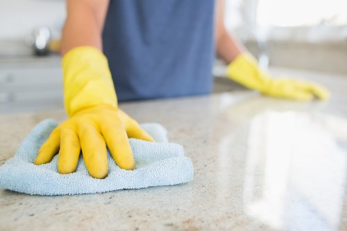 Cleaner using PPE during a carpet cleaning job